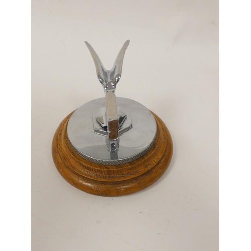 345 - Vintage c1930s Bentley chrome car mascot on wooden stand. Height 10.5cm