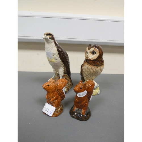 31 - Two Royal Doulton ceramic whisky decanters, Modelled as an Osprey and Short - Eared Owl, with conten... 