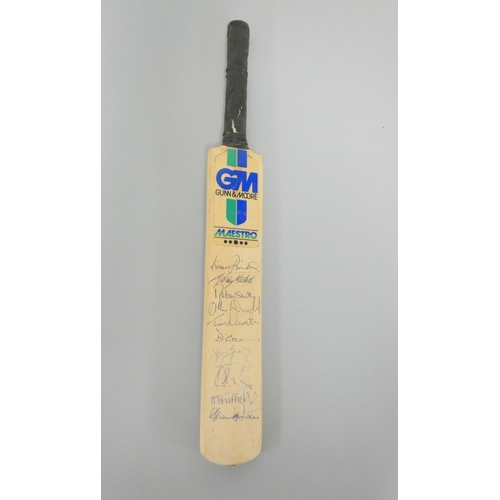 390 - Miniature cricket bat signed by England team players, Robin Smith (England's Captain), Michael Marsh... 