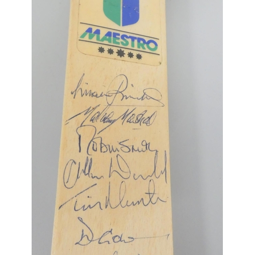 390 - Miniature cricket bat signed by England team players, Robin Smith (England's Captain), Michael Marsh... 