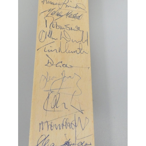 390 - Miniature cricket bat signed by England team players, Robin Smith (England's Captain), Michael Marsh... 