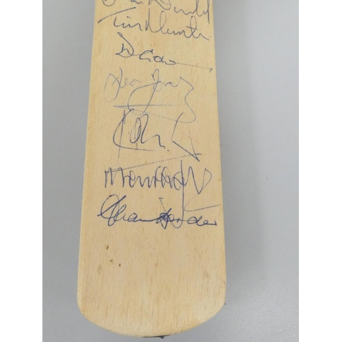 390 - Miniature cricket bat signed by England team players, Robin Smith (England's Captain), Michael Marsh... 