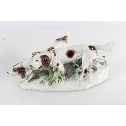 433 - Meissen porcelain figure group modelled as two gun dogs tracking a scent, blue crossed swords mark t... 