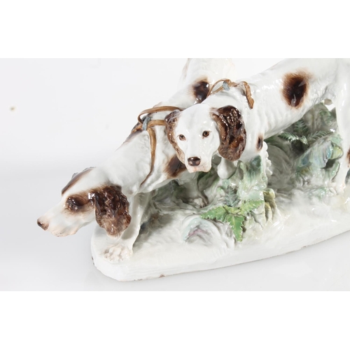 433 - Meissen porcelain figure group modelled as two gun dogs tracking a scent, blue crossed swords mark t... 