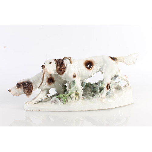 433 - Meissen porcelain figure group modelled as two gun dogs tracking a scent, blue crossed swords mark t... 