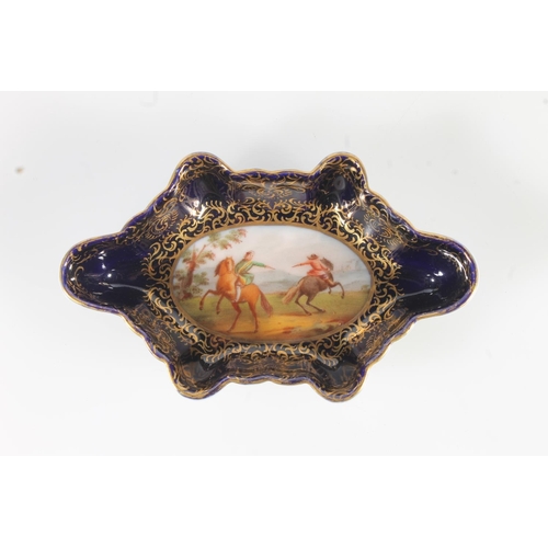 446 - Dresden blue and gilt porcelain lobed dish with hand painted central vignette depicting figures on h... 