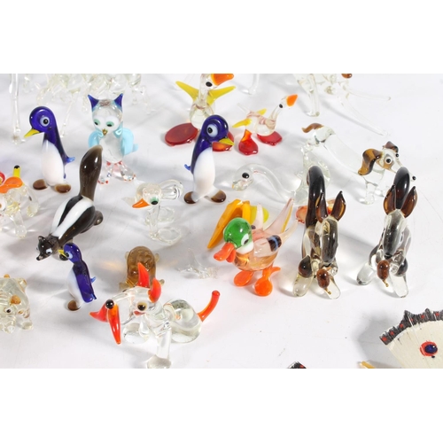 460 - Murano art glass clown and a group of Italian miniature glass animal models.