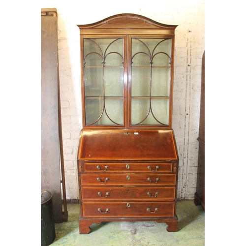 533 - 19th century mahogany and satinwood crossbanded bureau bookcase, the arch top pediment above two ast... 