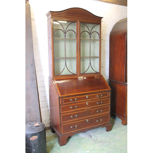 533 - 19th century mahogany and satinwood crossbanded bureau bookcase, the arch top pediment above two ast... 