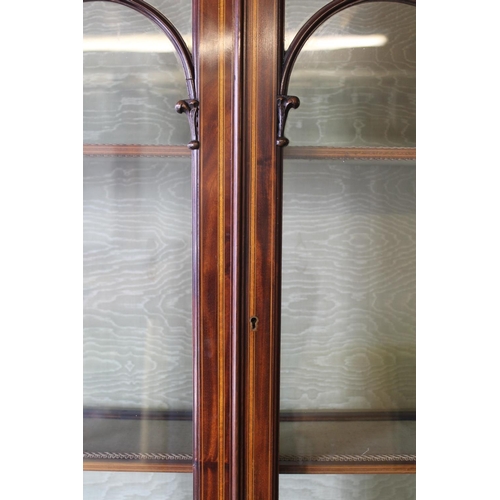 533 - 19th century mahogany and satinwood crossbanded bureau bookcase, the arch top pediment above two ast... 