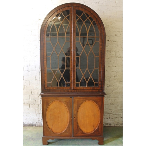 534 - 19th century mahogany and satinwood display cabinet, the arch top above two astragal glazed cupboard... 