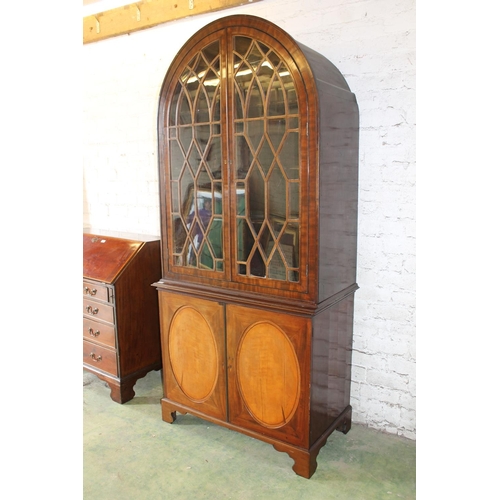 534 - 19th century mahogany and satinwood display cabinet, the arch top above two astragal glazed cupboard... 