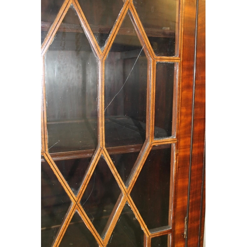 534 - 19th century mahogany and satinwood display cabinet, the arch top above two astragal glazed cupboard... 