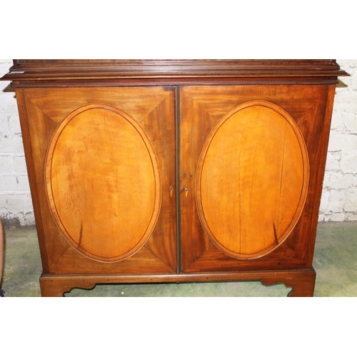 534 - 19th century mahogany and satinwood display cabinet, the arch top above two astragal glazed cupboard... 