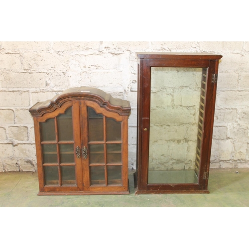 537 - Two mahogany wall cabinets.