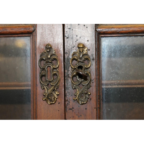 537 - Two mahogany wall cabinets.