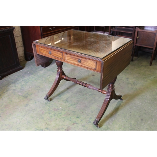 541 - Antique mahogany sofa table with two drop leafs, frieze drawers above trestle ends capped by brass f... 