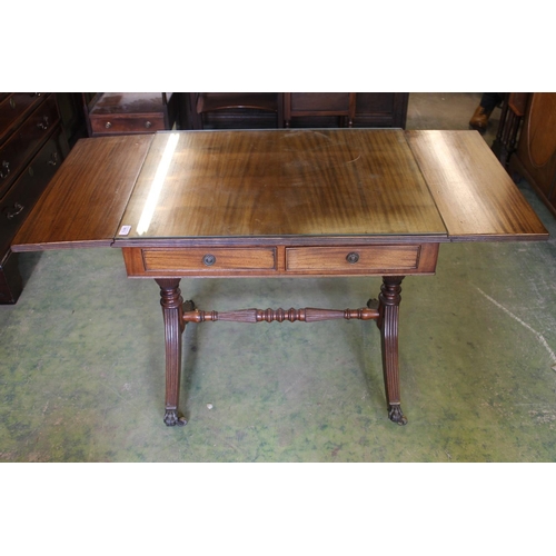 541 - Antique mahogany sofa table with two drop leafs, frieze drawers above trestle ends capped by brass f... 