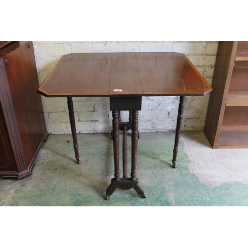 546 - 19th century mahogany and satinwood crossbanded gate leg table raised on turned supports, 76cm long.