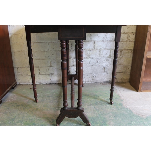 546 - 19th century mahogany and satinwood crossbanded gate leg table raised on turned supports, 76cm long.