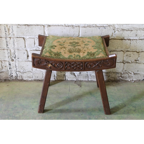 550 - Scottish Arts & Crafts style carved oak stool, 51cm long.