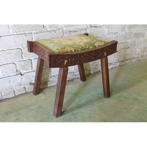 550 - Scottish Arts & Crafts style carved oak stool, 51cm long.