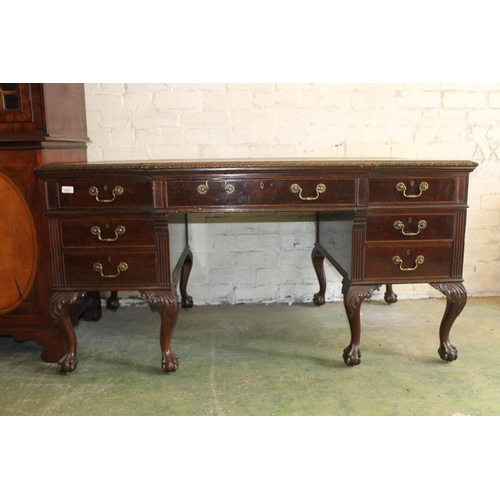 554 - 19th century mahogany breakfront desk, the top with inset brown leather skiver above carved moulded ... 