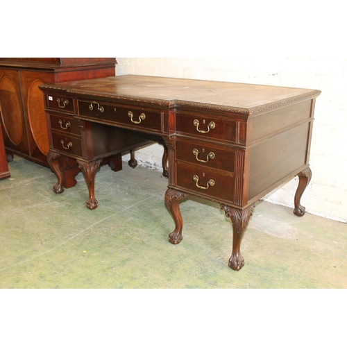 554 - 19th century mahogany breakfront desk, the top with inset brown leather skiver above carved moulded ... 