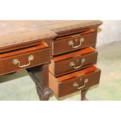 554 - 19th century mahogany breakfront desk, the top with inset brown leather skiver above carved moulded ... 