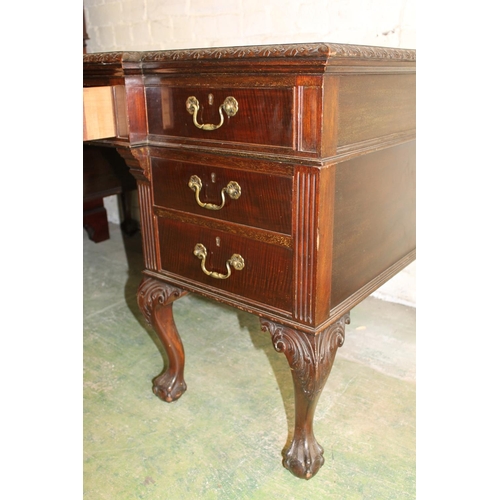 554 - 19th century mahogany breakfront desk, the top with inset brown leather skiver above carved moulded ... 