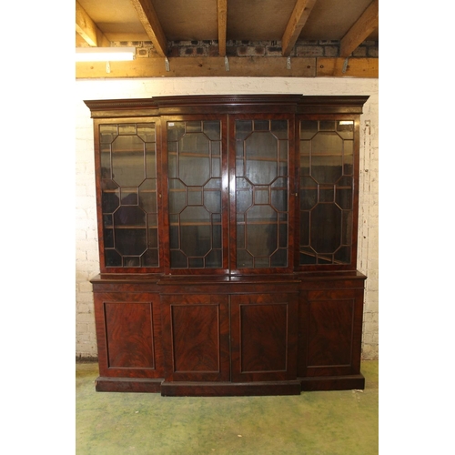 557 - Antique figured mahogany four door breakfront library bookcase, the cornice with dentil work frieze ... 