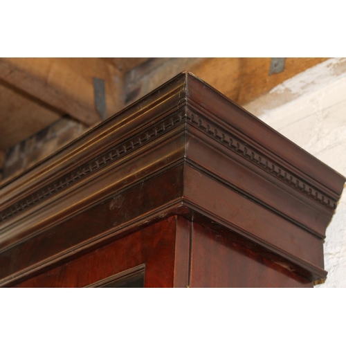 557 - Antique figured mahogany four door breakfront library bookcase, the cornice with dentil work frieze ... 