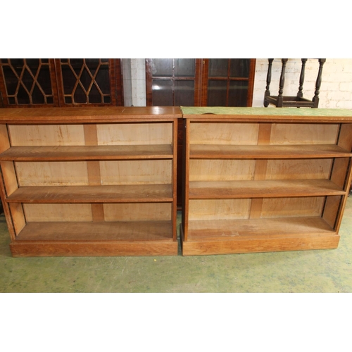 558 - Pair of oak open bookcases.