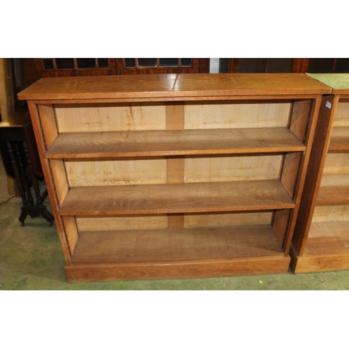 558 - Pair of oak open bookcases.