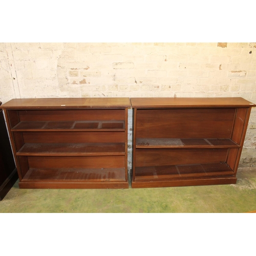 564 - Pair of mahogany open bookcases, 123cm long. (2)