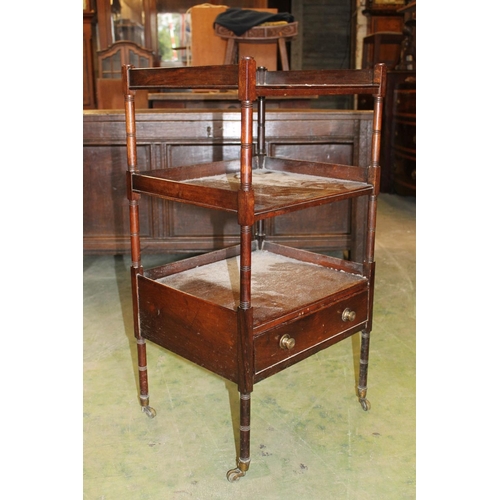 566 - Antique rosewood étagère with base drawer raised on turned supports capped by castors, 43cm wide.