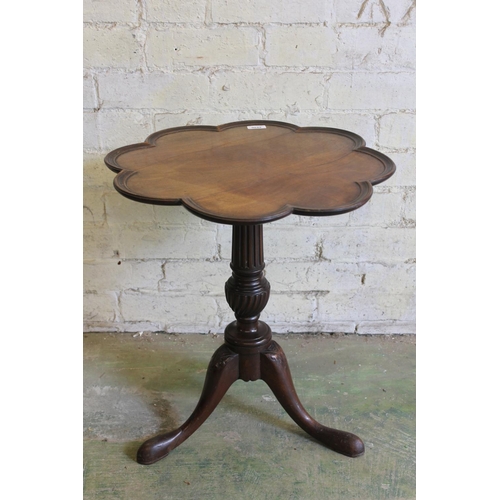 576 - 19th century mahogany occasional table with lobed edge raised on turned and fluted column with three... 