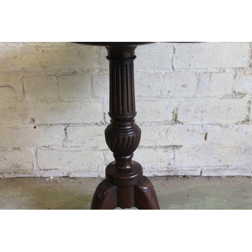 576 - 19th century mahogany occasional table with lobed edge raised on turned and fluted column with three... 