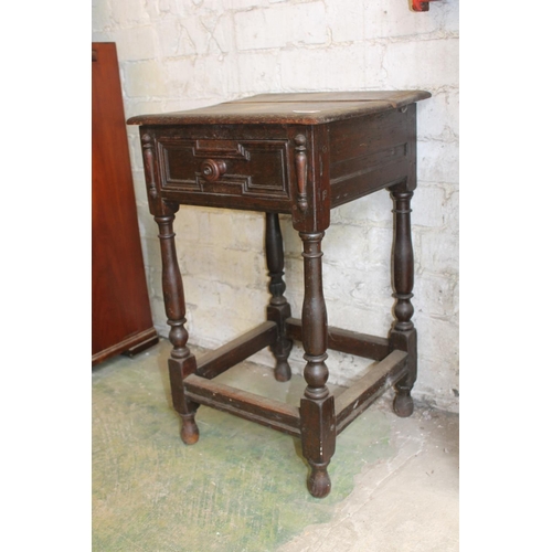 591 - Carved oak bedside table with frieze drawer.