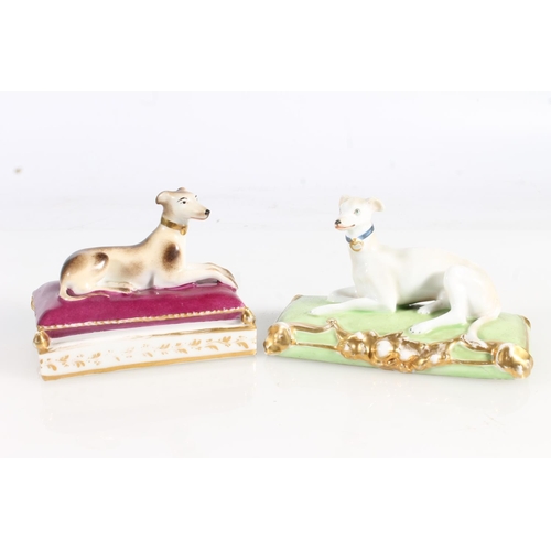 436 - Two 19th century porcelain models of dogs sat upon cushions, also another pair. (4)