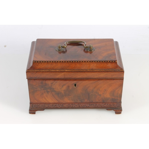 447 - 19th century flame mahogany tea caddy of casket form with fret carved band, raised on squat ogee bra... 