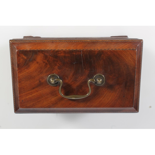 447 - 19th century flame mahogany tea caddy of casket form with fret carved band, raised on squat ogee bra... 