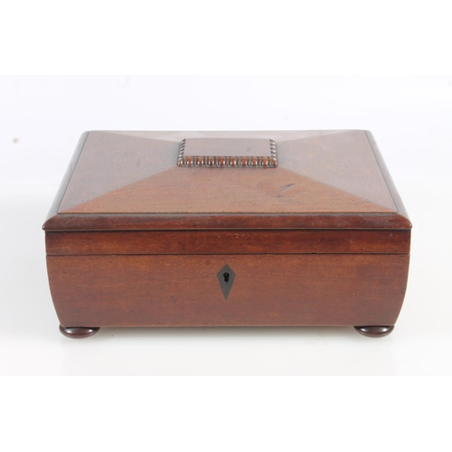 449 - 19th century mahogany sewing box of sarcophagus form with fitted interior, raised on bun feet, 26cm ... 