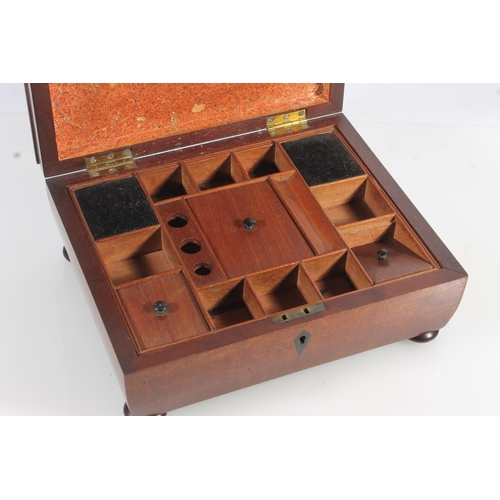 449 - 19th century mahogany sewing box of sarcophagus form with fitted interior, raised on bun feet, 26cm ... 