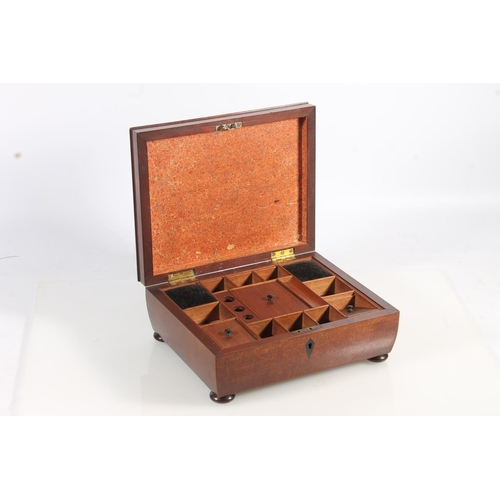 449 - 19th century mahogany sewing box of sarcophagus form with fitted interior, raised on bun feet, 26cm ... 