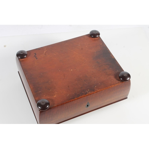 449 - 19th century mahogany sewing box of sarcophagus form with fitted interior, raised on bun feet, 26cm ... 