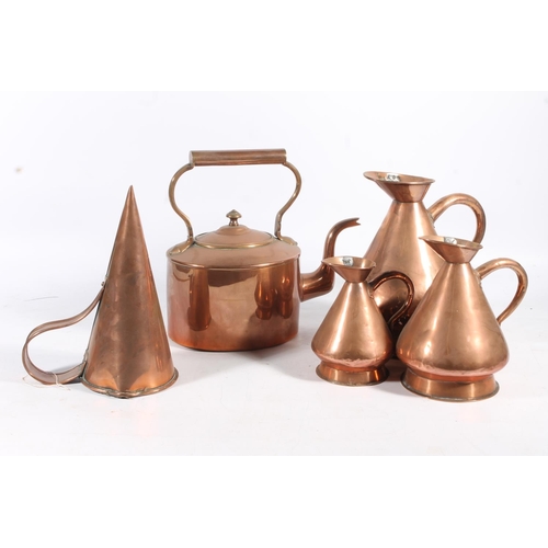 451 - Copper metal ware to include mulling cone, kettle and a graduated set of three harvest measure jugs.... 