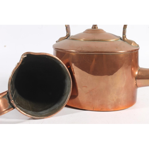 451 - Copper metal ware to include mulling cone, kettle and a graduated set of three harvest measure jugs.... 