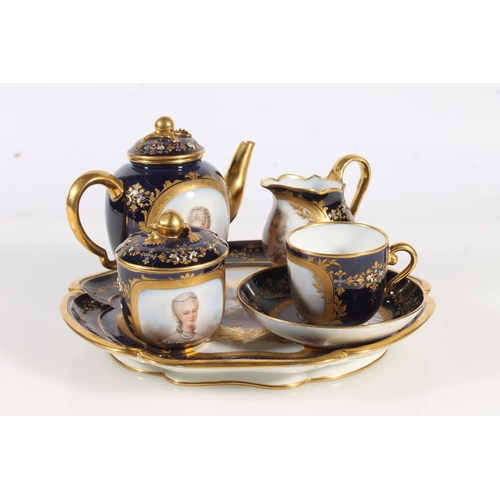 458 - Sevres Chateau de Fountainbleau porcelain breakfast set comprising circular tray, teapot, sugar bowl... 