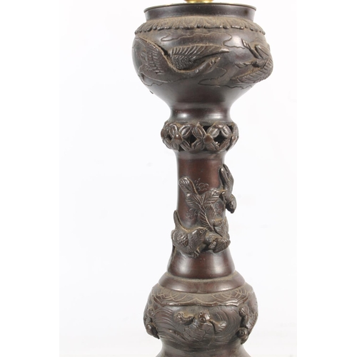 479 - Pair of Oriental bronze table lamps of incense burner form decorated with relief flowers and foliage... 